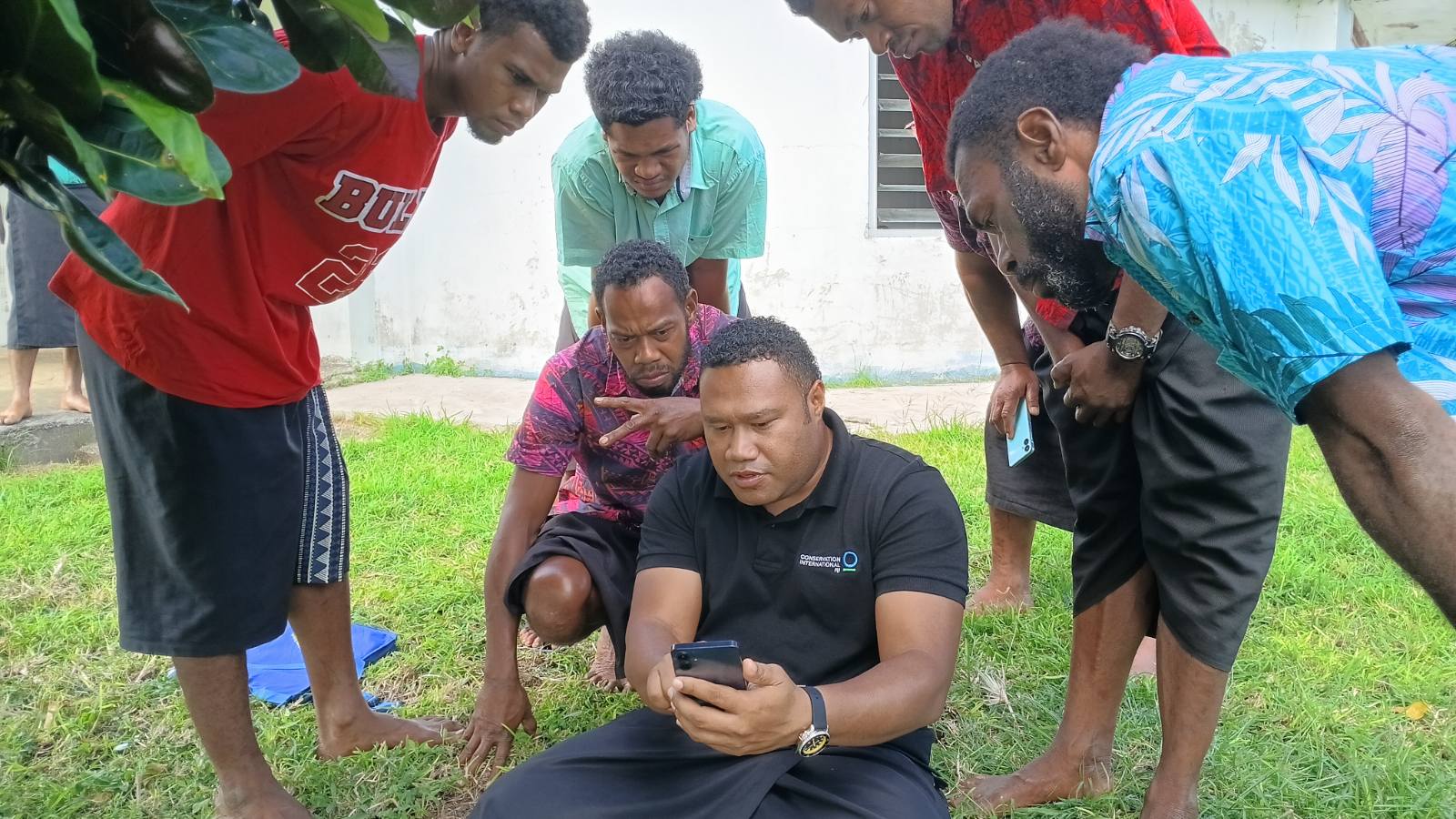 Conservation International staff providing iKatch training to fishers